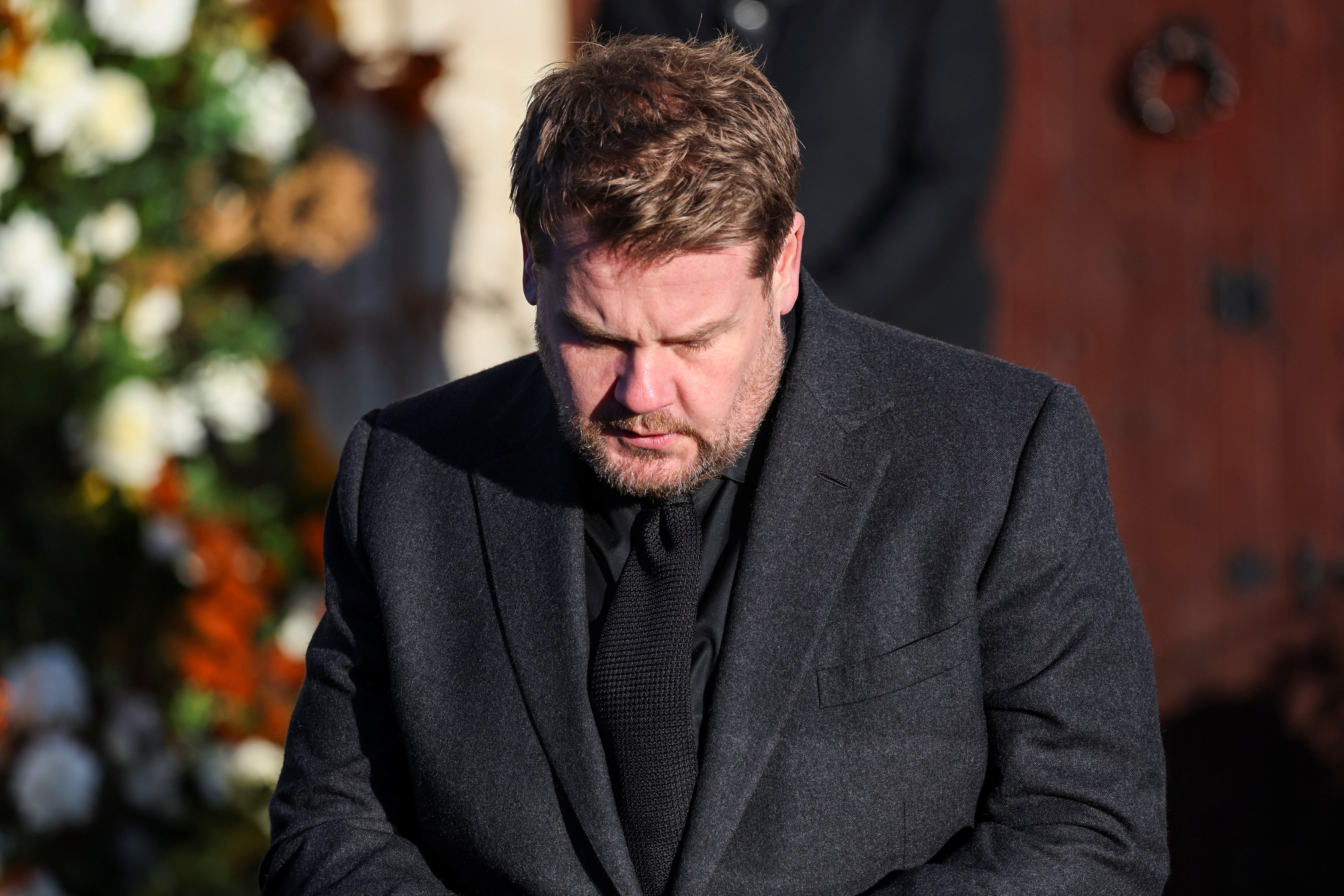 Actor and comedian James Corden looks on, on the day of the funeral of former One Direction singer Liam Payne at St. Mary's Church in Amersham, near London, Britain, November 20, 2024. REUTERS/Toby Melville