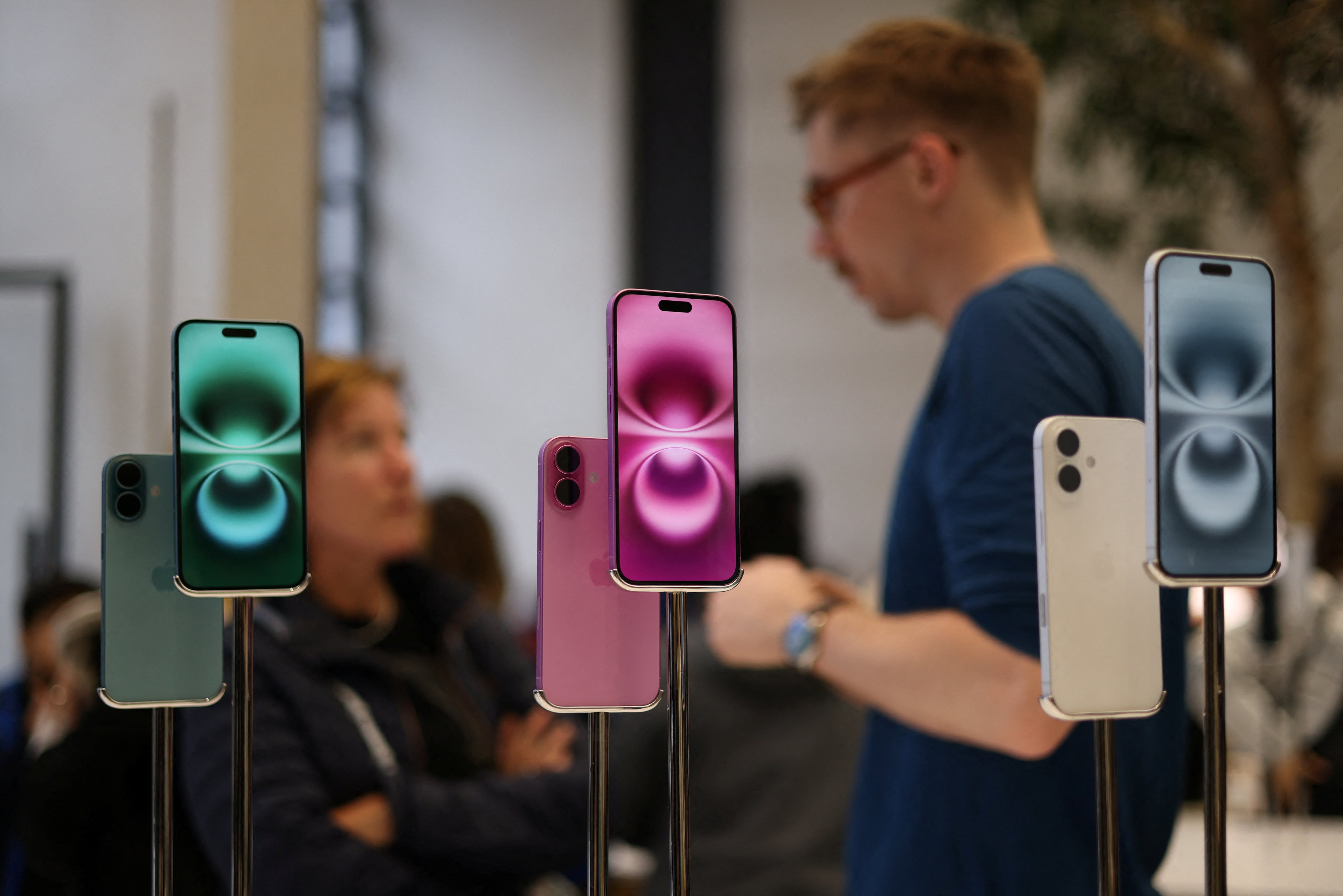 Apple iPhone 16 smartphones are displayed at a store in London, Britain, October 6, 2024. REUTERS/Hollie Adams