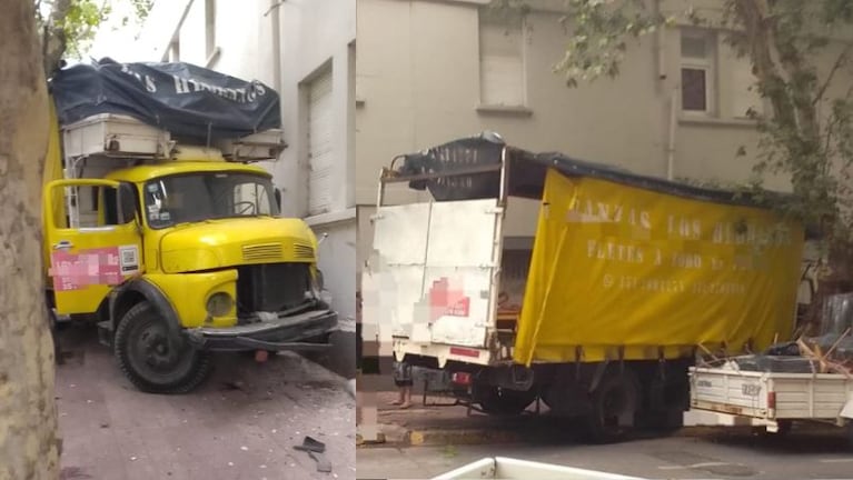 El camión de mudanzas chocó contra un edificio.