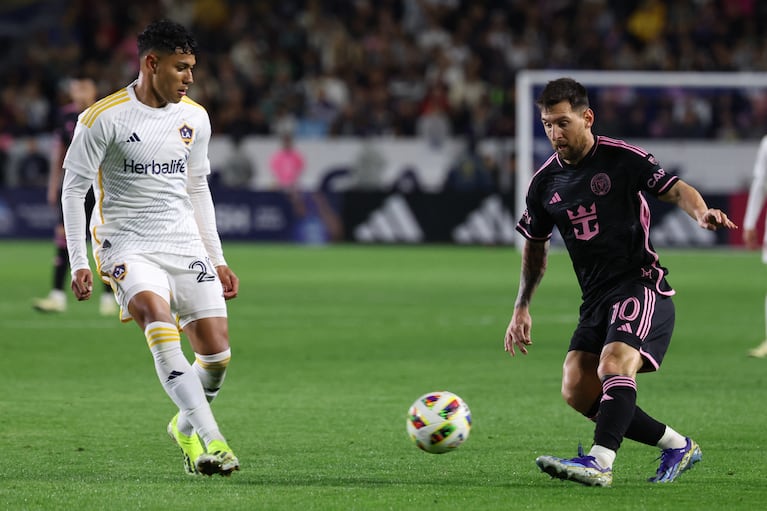 Feb 25, 2024; Carson, California, USA; Inter Miami CF forward Lionel Messi (10) plays the ball against the LA Galaxy during the second half at Dignity Health Sports Park. Mandatory Credit: Kiyoshi Mio-USA TODAY Sports
