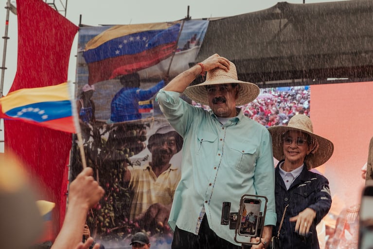 FILE -- Nicolás Maduro, the leader of Venezuela, stands in the rain during a rally in Caracas, Venezuela, Dec. 10, 2025. Venezuelan security forces have detained several Americans in the months since the Trump administration began a military and economic pressure campaign against the government of the South American nation, according to a U.S. official familiar with the matter. (Adriana Loureiro Fernandez/The New York Times)