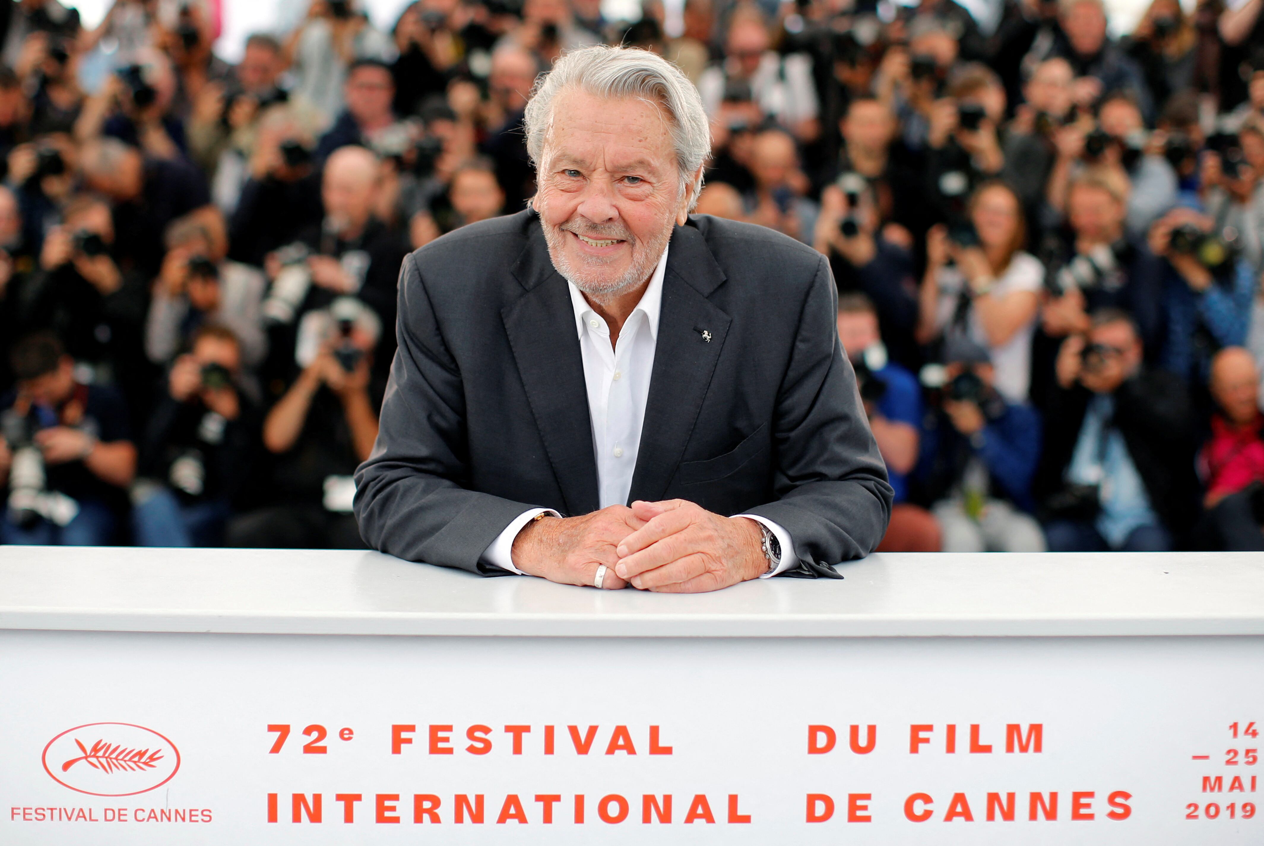 FILE PHOTO: 72nd Cannes Film Festival - Honorary Palme d’Or Award - Photocall - Cannes, France, May 19, 2019. Alain Delon poses. REUTERS/Jean-Paul Pelissier/File Photo