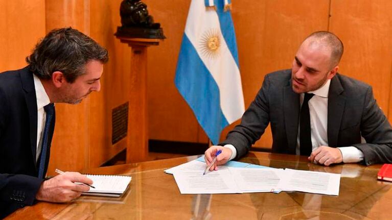 Guillermo Hang junto a Martín Guzmán.