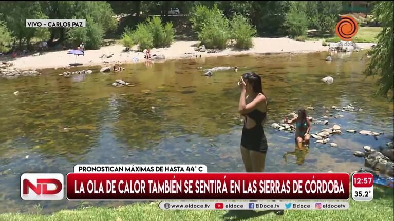 Carlos Paz: turistas pasan la ola de calor en el río