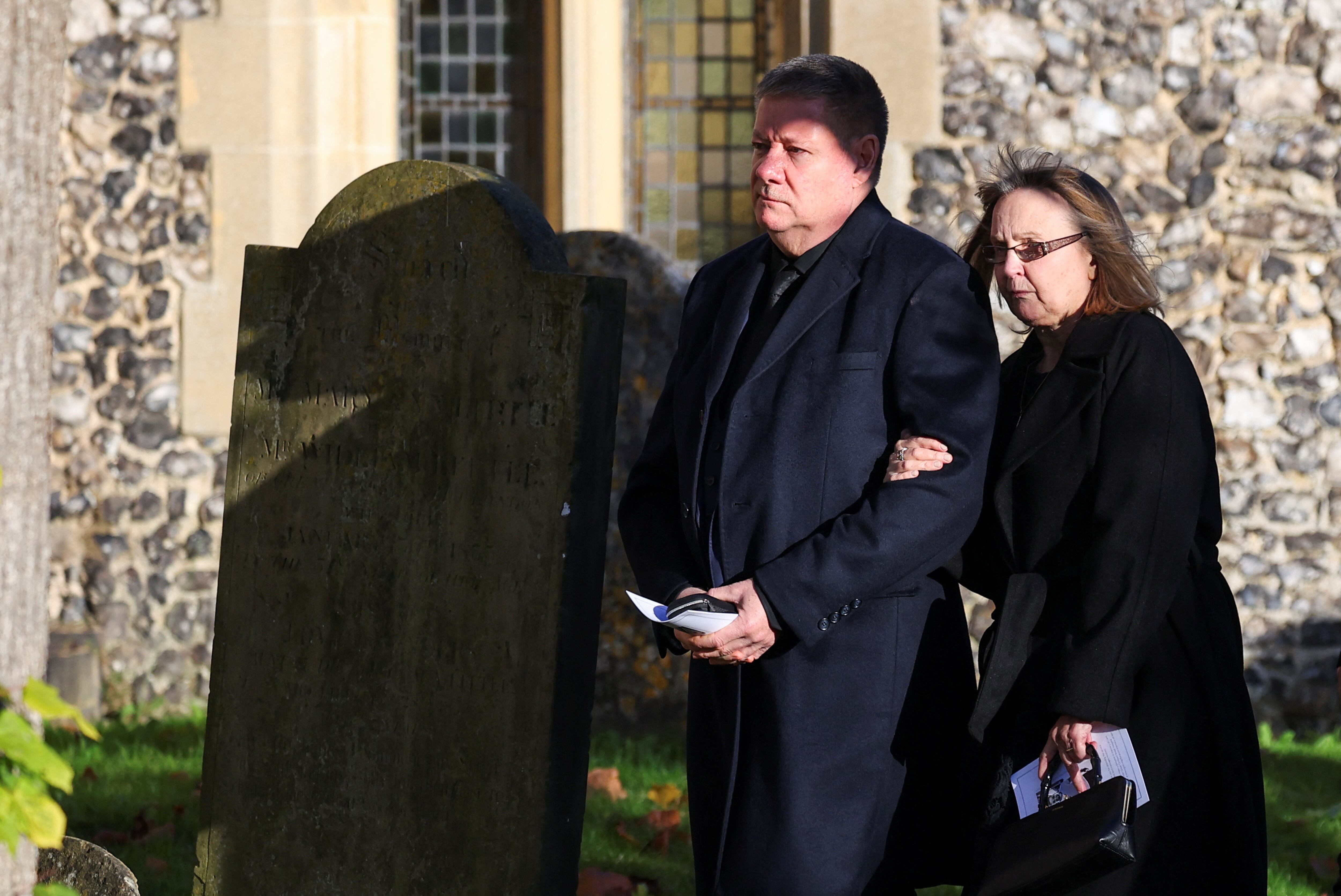 Karen and Geoff Payne, parents of former One Direction singer Liam Payne, walk on the day of the funeral of former One Direction singer Liam Payne at St. Mary's Church in Amersham, near London, Britain, November 20, 2024. REUTERS/Toby Melville