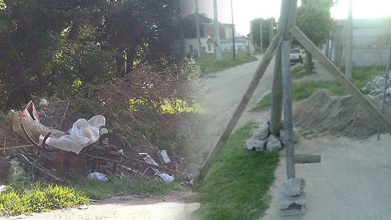 La mugre invade las calles y un poste pone en peligro a una vivienda.