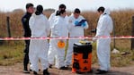 Los agentes trabajaron en el lugar del espanto para recoger los restos del nene. Foto: Télam.