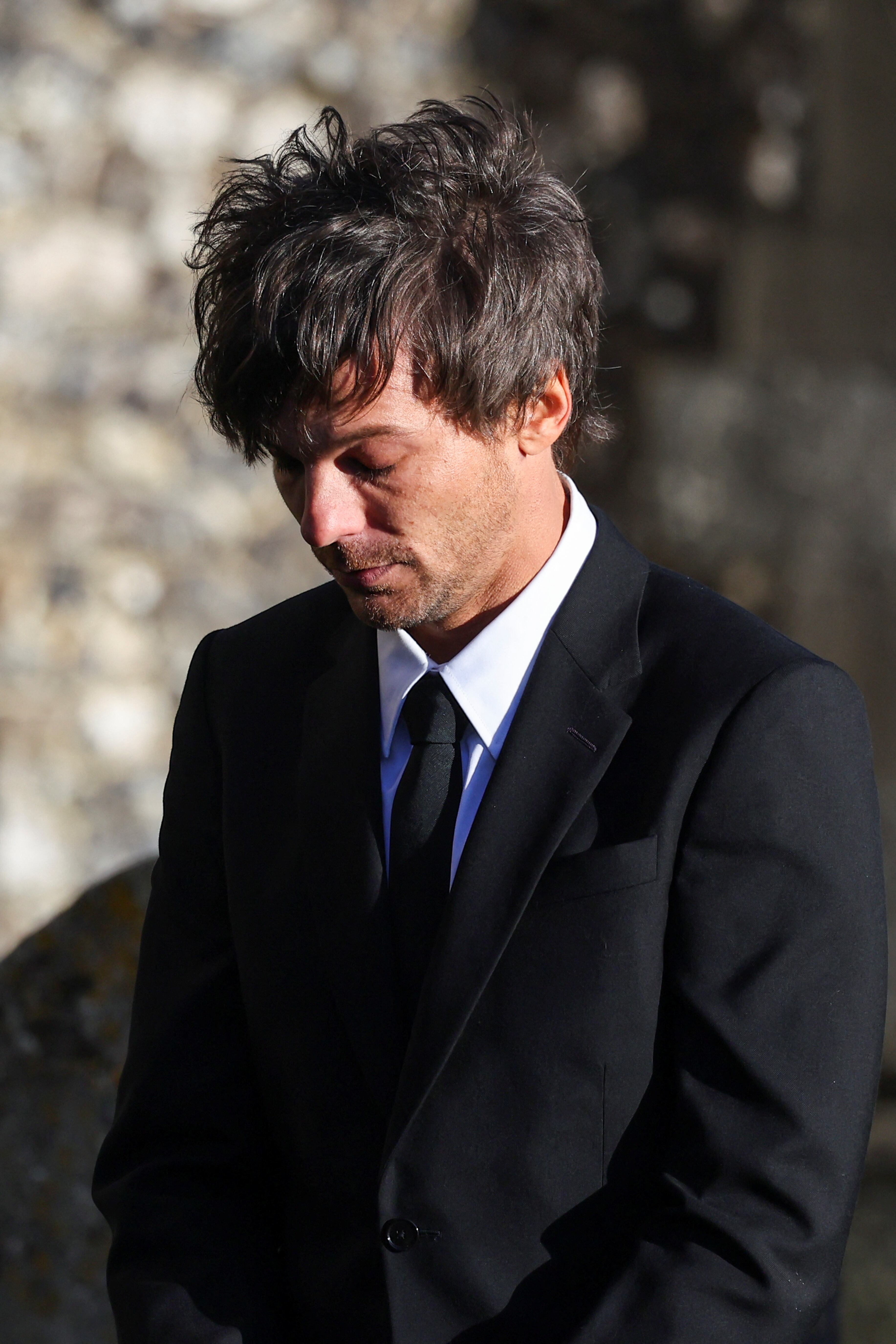 Louis Tomlinson departs after the funeral of former One Direction singer Liam Payne at St. Mary's Church in Amersham, near London, Britain, November 20, 2024. REUTERS/Toby Melville