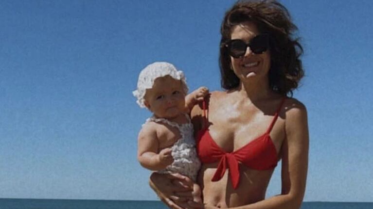 Macedo y su pequeña hija en Punta del Este.