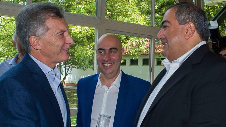 Mauricio Macri y Héctor Daer, intercambiando sonrisas.