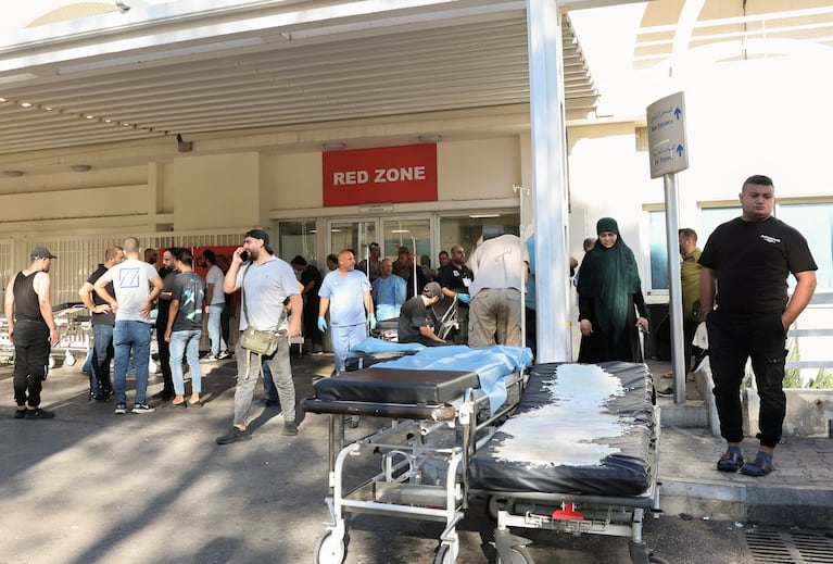 People gather outside a hospital, as hundreds of members of the Lebanese armed group Hezbollah, including fighters and medics, were seriously wounded on Tuesday when the pagers they use to communicate exploded, according to a security source, in Beirut, Lebanon September 17, 2024. REUTERS/Mohamed Azakir