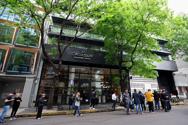 People gather outside the hotel where Liam Payne, former One Direction band member, was found dead after he fell from a third-floor hotel room balcony, in Buenos Aires, Argentina, October 17, 2024. REUTERS/Agustin Marcarian