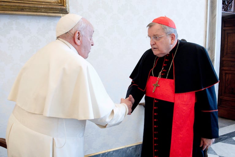 Pope Francis and Cardinal Raymond Leo Burke shake hands at the Vatican, December 29, 2023. Vatican Media/Handout via REUTERS ATTENTION EDITORS - THIS IMAGE WAS PROVIDED BY A THIRD PARTY.