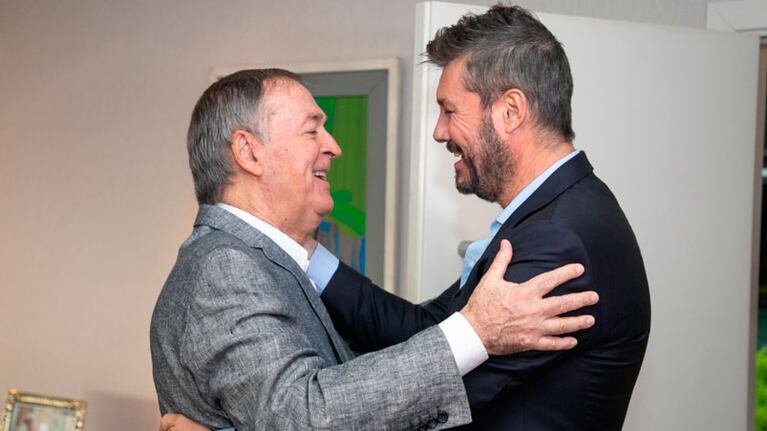 Schiaretti y Tinelli, en una reunión repleta de sonrisas.