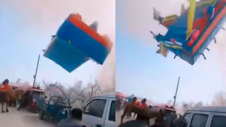 Tras suspenderse en el aire varios segundos, el juego inflable se partió en dos. / Foto: Captura de video