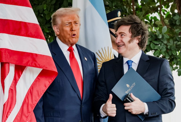 U.S. President Donald Trump and Argentina's President Javier Milei react at the White House in Washington, D.C., U.S., October 14, 2025. REUTERS/Jonathan Ernst